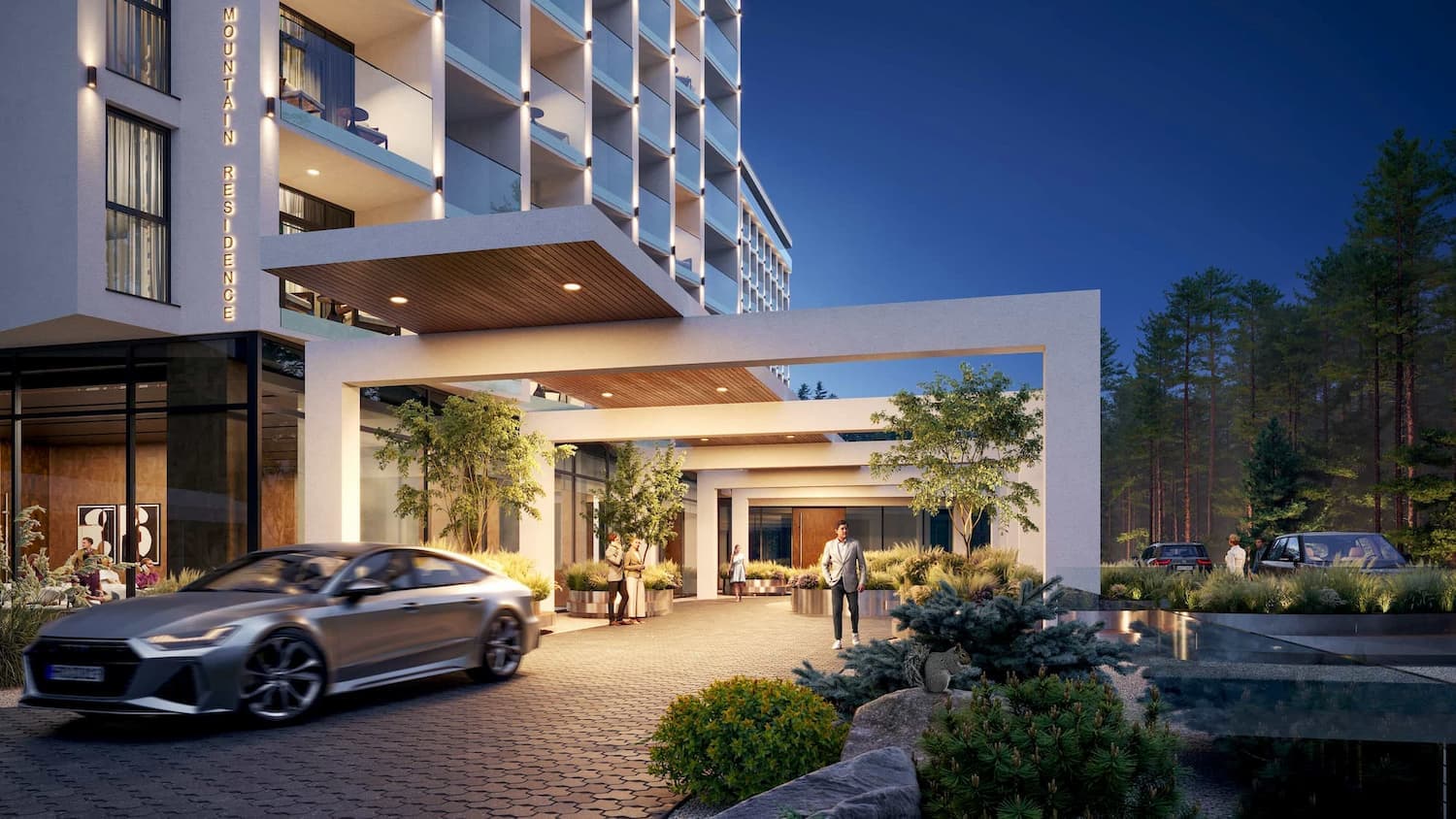 Evening Mountain Hospitality Complex entrance with a canopy and landscaped arrival court